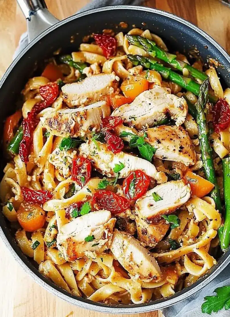 Creamy Chicken and Vegetable Pasta with Bell Peppers, Asparagus, and Sun-Dried Tomatoes